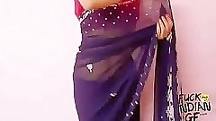 Young indian wife teaching how to wear saree